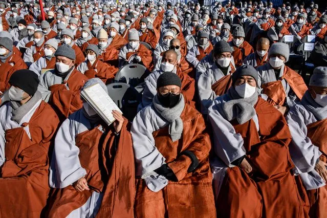 The Jogye Order, the largest Buddhist sect in South Korea, hold a mass rally of 5,000 Buddhists to protest against alleged “religious bias” by South Korean President Moon Jae-in's administration, at the Jogye temple in Seoul on January 21, 2022. (Photo by Anthony Wallace/AFP Photo)
