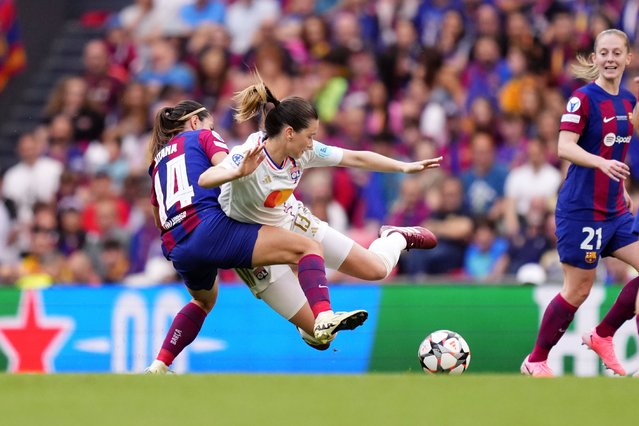 Lyon's Damaris Egurrola, center, is challenged by Barcelona's Aitana Bonmati, left, during the women's Champions League final soccer match between FC Barcelona and Olympique Lyonnais at the San Mames stadium in Bilbao, Spain, Saturday, May 25, 2024. (Photo by Jose Breton/AP Photo)