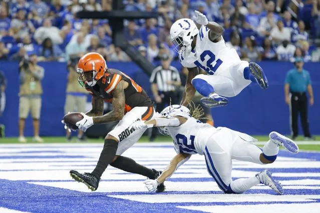 Cleveland Browns wide receiver Derrick Willies (84) makes a catch for a touchdown in front of Indianapolis Colts cornerback Jalen Collins (32) and defensive back Rolan Milligan (42) during the second half of an NFL preseason football game in Indianapolis, Saturday, August 17, 2019. (Photo by A.J. Mast/AP Photo)