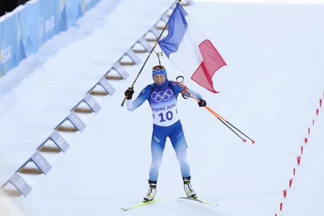 Justine Braisaz-Bouchet of France crosses the finish line during the women's 12.5-kilometer mass start biathlon at the 2022 Winter Olympics, Friday, February 18, 2022, in Zhangjiakou, China. (Photo by Kirsty Wigglesworth/AP Photo)