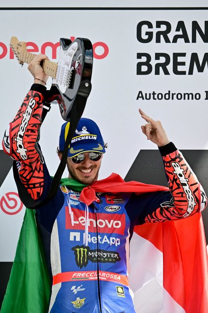 Ducati Italian rider Francesco Bagnaia celebrates on the podium after winning the Italian MotoGP race at Mugello on June 2, 2024. (Photo by Marco Bertorello/AFP Photo)