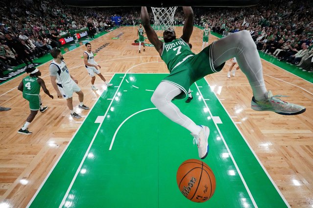 Boston Celtics guard Jaylen Brown dunks against the Dallas Mavericks during the first quarter in game five of the 2024 NBA Finals in Boston on June 18, 2024. (Photo by Peter Casey/USA TODAY Sports)