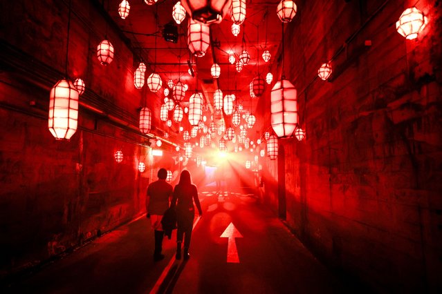 People view an installation of projections and lights called “Dark Spectrum” located at old tram tunnels as part of the annual Vivid Sydney festival in Sydney on May 24, 2024. (Photo by David GrayAFP Photo)