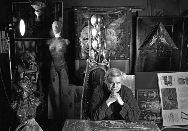 A black and white file photo dated 29 January 1995 shows Swiss artist H. R. Giger in his home in Zurich, Switzerland. Giger died on 12 May 2014 aged 74, according to Swiss media. He was a surrealist painter, sculptor, and set designer, and was part of the special effects team that won an Academy Award for Best Achievement for Visual Effects for their design work on the film “Alien”. (Photo by Martin Ruetschi/EPA)