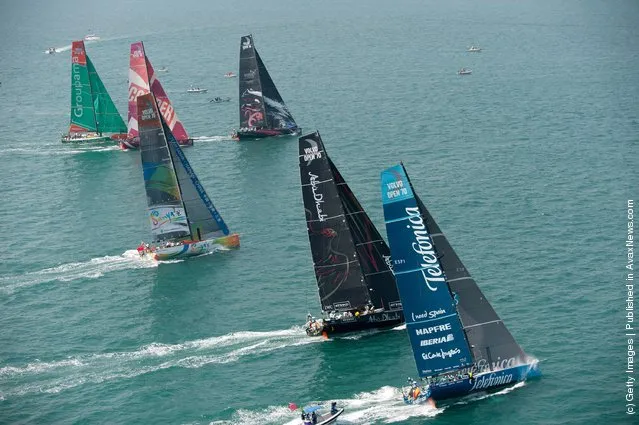 The fleet of Volvo Open 70's power away from the line, at the start of leg 4 of the Volvo Ocean Race 2011-12 on February 19, 2012