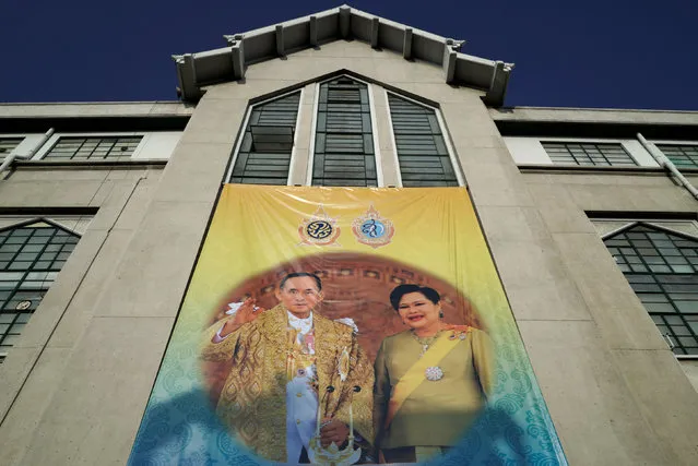 A banner depicting Thailand's King Bhumibol Adulyadej and Queen Sirikit hang on a government building in Bangkok, Thailand, June 6, 2016. (Photo by Athit Perawongmetha/Reuters)