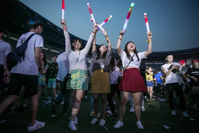 South Korean youths dance to electronic music during the Ultra Music Festival Korea at Olympic Stadium on June 10, 2016 in Seoul, South Korea. (Photo by Jean Chung/Getty Images)