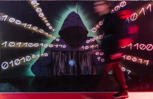 A participant takes part on the first day of the 36C3 Chaos Communication Congress on December 27, 2019 in Leipzig, Germany. The four-day event under the topic “Resource Exhaustion” brings together about 17,000 hackers, artists, researchers, technology fans and others from across the globe for seminars and workshops on privacy, security, social issues, ethics, government, science and other issues in their relation to digital technology. (Photo by Jens Schlueter/Getty Images)