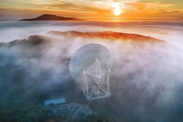 This handout photograph released on June 29, 2023 shows the Max Planck Institute for Radio Astronomy's Radio Telescope Effelsberg near Bad Munstereifel. Astronomers across the world announced on June 29 that they have found the first evidence of a long-theorised form of gravitational waves that create a “background hum” rumbling throughout the universe. (Photo by Norbert Tacken/Max Planck Institute for Radio Astronomy/AFP Photo)