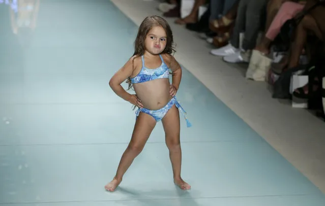 Model Taylen Biggs, 3, walks down the runway wearing Lybethras swimwear at a FUNKSHION fashion show during Swim Week, Sunday, July 23, 2017, in Miami Beach, Fla. (Photo by Lynne Sladky/AP Photo)