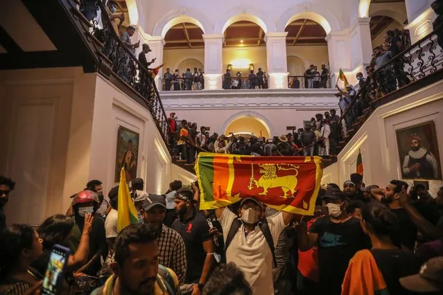 Protesters inside the president's official residence premises during the anti government protest in Colombo, Sri Lanka, 09 July 2022. Thousands of protesters broke through police barricades and stormed the president's official residence during the anti government protest in Colombo. Protests have been rocking the country for over three months, calling for the resignation of the president and prime minister over the alleged failure to address the economic crisis. Sri Lanka faces its worst-ever economic crisis in decades due to the lack of foreign reserves, resulting in severe shortages in food, fuel, medicine, and imported goods. (Photo by Chamila Karunarathne/EPA/EFE/Rex Features/Shutterstock)