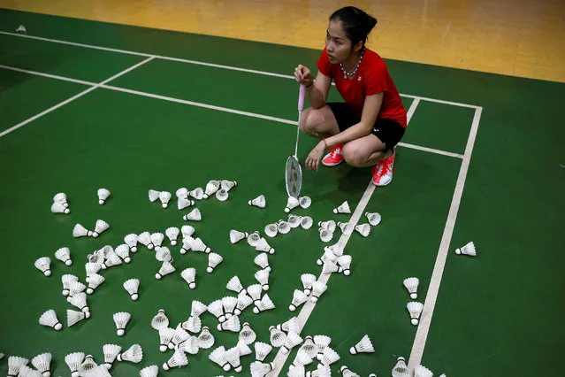 Thailand's badminton player Ratchanok Intanon, who hopes to win gold at the Rio Olympics, takes a break during an afternoon training session at a gym in Bangkok, Thailand, June 22, 2016. (Photo by Athit Perawongmetha/Reuters)