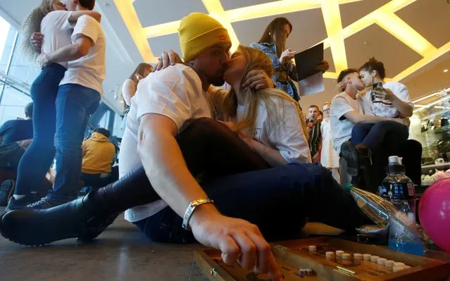 People take part in the kissing marathon competition ahead of Valentine's Day in Minsk, Belarus on February 9, 2020. (Photo by Vasily Fedosenko/Reuters)