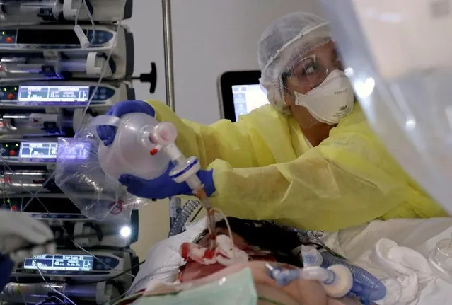 A member of the medical personnel works as patients suffering from coronavirus disease (COVID-19) are treated at the intensive care unit at CHIREC Delta Hospital in Brussels, Belgium, April 18, 2020. (Photo by Yves Herman/Reuters)