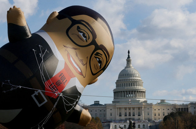 Demonstrators with MoveOn, stage a protest calling for the expulsion of U.S. Rep. George Santos (R-NY) featuring a large balloon version of Santos outside of the U.S. Capitol building Washington on November 28, 2023. (Photo by Leah Millis/Reuters)