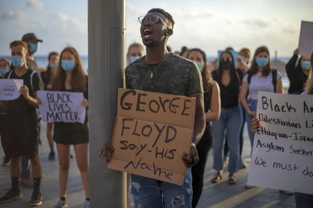 Protesters shout slogans during a protest to decry the killing of George Floyd in front of the American embassy in Tel Aviv, Israel, Tuesday, June 2, 2020. (Photo by Ariel Schalit/AP Photo)