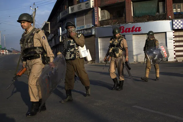 Indian paramilitary soldiers patrol during curfew in Srinagar, Indian-controlled Kashmir, Friday, August 19, 2016. The Himalayan region has been under curfew for almost six weeks as the largest street protests in years erupted after Indian troops killed a top rebel leader, and security was tightened further in the week preceding India's Independence day. (Photo by Dar Yasin/AP Photo)