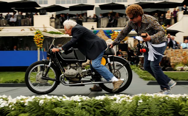 A 1954 BMW Rennsport owned by Virgil Elings gets a push off the stage after winning an award in the BMW Motorcycle class during the Concours d'Elegance in Pebble Beach, California, U.S. August 21, 2016. (Photo by Michael Fiala/Reuters/Courtesy of The Revs Institute)
