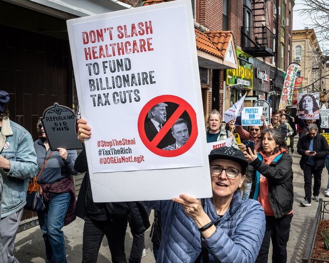 A coalition of progressive organizations and unions including Indivisible Brooklyn and 1199 SEIU United Healthcare Workers East march to the Bay Ridge office of Congresswoman Nicole Malliotakis (R-Brooklyn) protesting her vote to cut funding for federal health care programs and tax cuts for billionaires in Brooklyn, New York, on March 22, 2025. (Photo by Gabriele Holtermann/AP Photo)