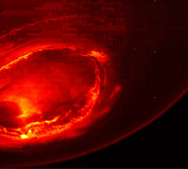 This August 27, 2016 infrared image provided by NASA shows the southern aurora of Jupiter, captured by NASA's Juno spacecraft. The phenomenon can hardly be seen from Earth due to the position of the two planets. The image is a mosaic of three photographs made as the spacecraft was moving away from the gas giant. (Photo by NASA/JPL-Caltech/SwRI/MSSS via AP Photo)