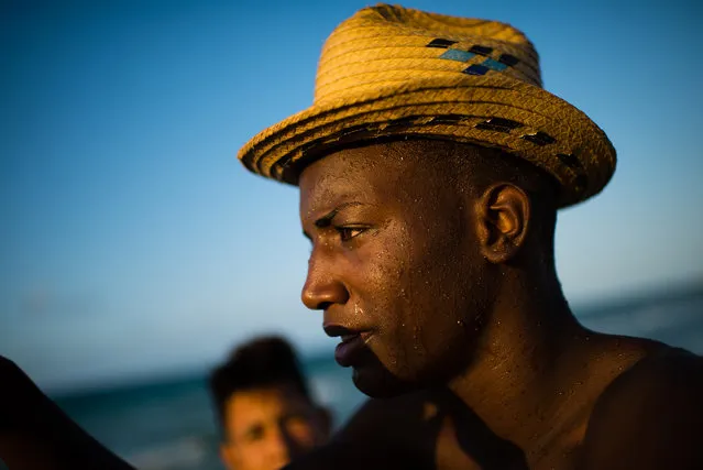 Yasiel Vazquez, 21, is pictured at Guanabo beach. The seaside beach town is about 20 miles East of Havana. The government has made the recovery of this beach a priority and some government and private homes are already being demolished. In some cases, new buildings will be built. (Photo by Sarah L. Voisin/The Washington Post)