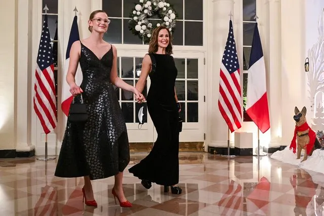 US actress Jennifer Garner and her daughter Violet Affleck arrive at the White House to attend a state dinner honoring French President Emmanuel Macron, in Washington, DC, on December 1, 2022. (Photo by Roberto Schmidt/AFP Photo)