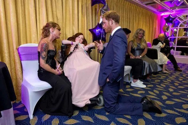 Prince Harry (3rd R) speaks with Megan Smith (2nd L), 17, Inspirational Young Person Award winner in the 15-18 years-old age group, and her mother Chevonne (L), as he attends the WellChild Awards, which recognises the courage of seriously ill children, at the London Hilton on October 5, 2015 in London, England. (Photo by Justin Tallis/WPA Pool/Getty Images)