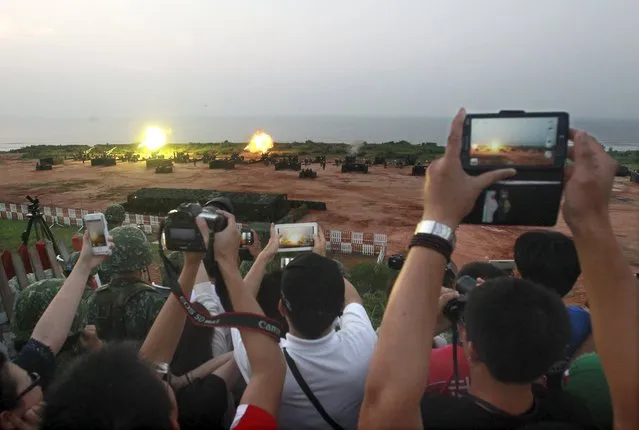 Local residents take pictures during the annual Han Kuang military exercise in Kinmen, Taiwan, September 8, 2015. (Photo by Pichi Chuang/Reuters)