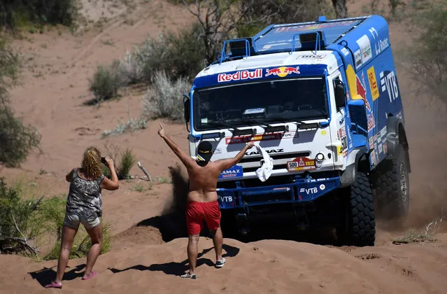 Kamaz Russian driver Eduard Nikolaev, co- driver Evgeny Yakovlev and mechanic Vladimir Rybakov compete during the 2018 Dakar Rally' s Stage 13 between San Juan and Cordoba in Argentina, on January 19, 2018. (Photo by Franck Fife/AFP Photo)