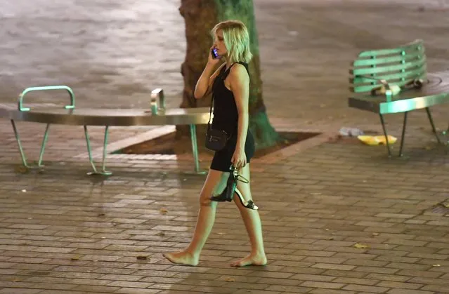 This fresher seems to have given up on wearing shoes for the night as she phones a friend after a night in Portsmouth, Hampshire on September 21, 2016. (Photo by Paul Jacobs/PictureExclusive.com)