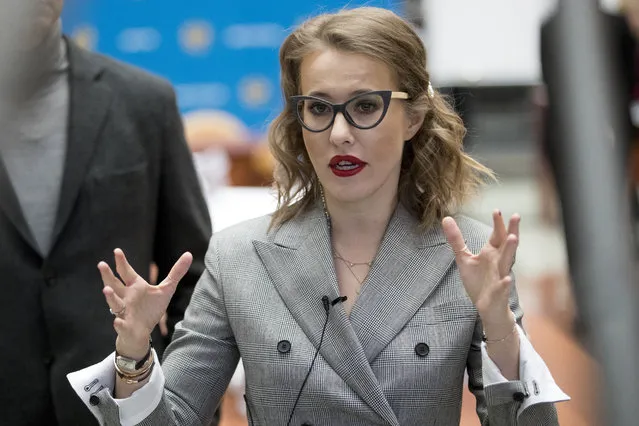 Russian celebrity TV host Ksenia Sobchak, who wants to challenge Russian President Vladimir Putin in the March 18 presidential election, speaks to media as she submits boxes containing signatures in support of her candidacy in the Central Election Commission in Moscow, Russia, Wednesday, January 31, 2018. (Photo by Pavel Golovkin/AP Photo)
