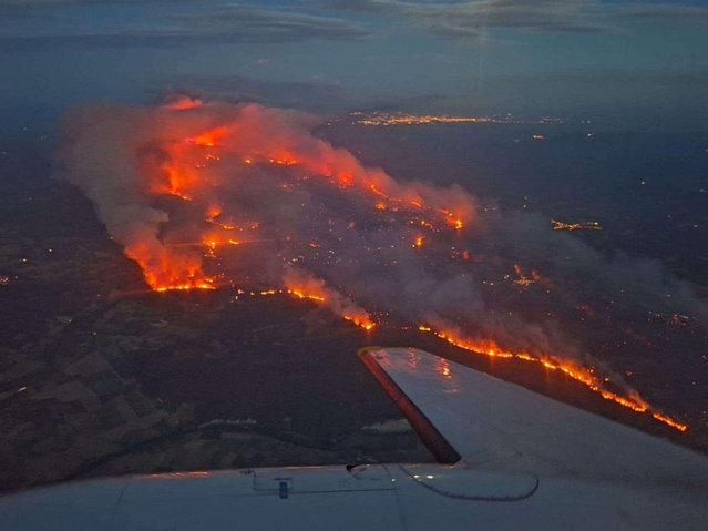 An aerial view of a wildfire, near the village of Saint-Laurent-de-la-Cabrerisse, southern France, on August 6, 2025. (Photo by Securite Civile/Handout via Reuters)