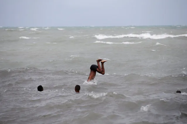 Boys swim in the ocean ahead of Hurricane Matthew in Les Cayes, Haiti, October 2, 2016. (Photo by Andres Martinez Casares/Reuters)