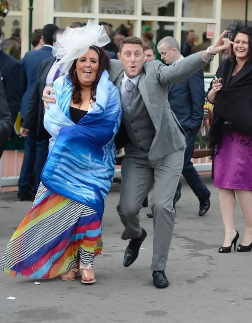 Racegoers react as they leave after the second day of the Grand National meeting at Aintree, northern England April 5, 2013. (Photo by Nigel Roddis/Reuters)