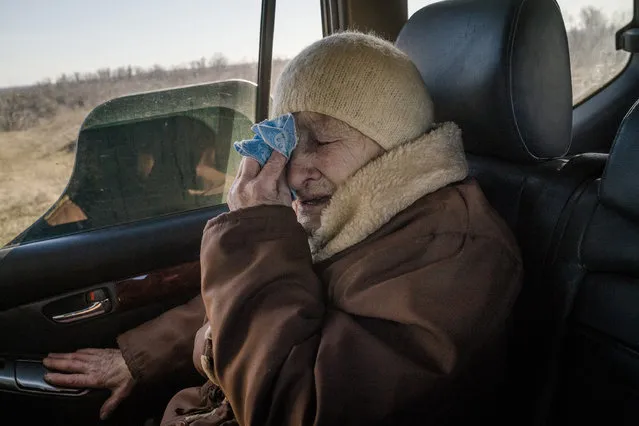 Chasiv Yar resident Anastasiya (Asya) Mezena, 94, cries as she leaves Chasiv Yar, Ukraine, on March 13, 2023. (Photo by Wojciech Grzedzinski/For The Washington Post)
