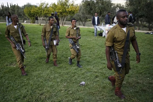 Israeli soldiers, who are members of the Ethiopian Jewish community in Israel, take part in a ceremony marking the holiday of Sigd in Jerusalem November 11, 2015. (Photo by Amir Cohen/Reuters)