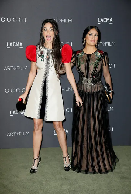 Actor Salma Hayek (R) surprises Demi Moore as she poses at the Los Angeles County Museum of Art (LACMA) Art+Film Gala in Los Angeles, October 29, 2016. (Photo by Danny Moloshok/Reuters)