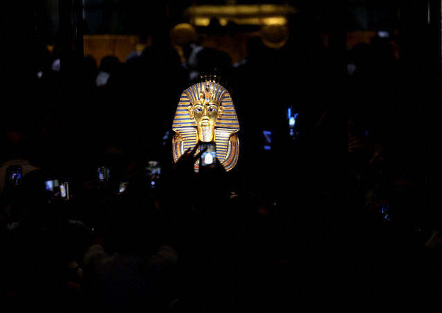 Visitors take photos of the golden burial mask of Egyptian Pharaoh Tutankhamun during the first day for visitors, after the official opening of the Grand Egyptian Museum (GEM), near the Giza pyramid complex, in Giza, Egypt, on November 4, 2025. (Photo by Mohamed Abd El Ghany/Reuters)