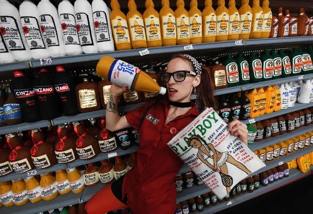 English contemporary artist Lucy Sparrow poses beside her latest art installation titled “Sparrow Mart Supermarket”, an entire supermarket with the products made from felt material, currently on display at the Standard Hotel in downtown Los Angeles on August 10, 2018. (Photo by Mark Ralston/AFP Photo)