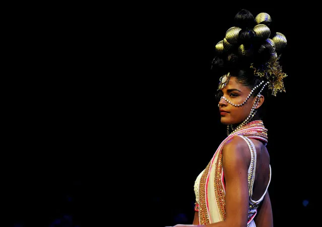 A model showcases a creation by designer Manish Arora during the Blenders Pride Fashion Tour 2016 in Mumbai on December 10, 2016. (Photo by AFP Photo/Stringer)