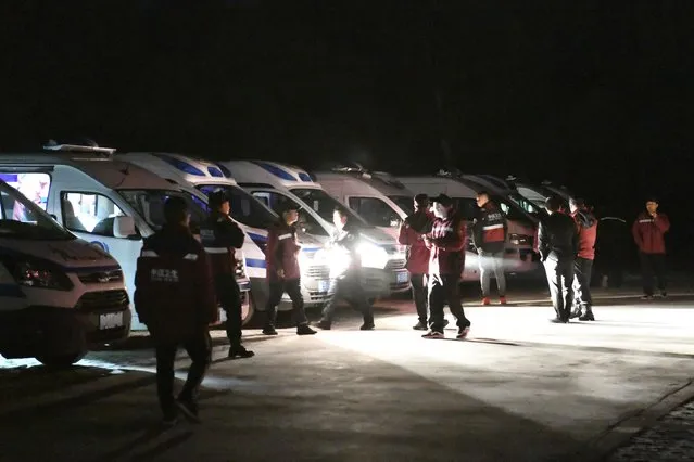 In this photo released by China's Xinhua News Agency, emergency personnel and vehicles wait on standby at the Yellow River Stone Forest tourist site in Baiyin in northwestern China's Gansu Province, Sunday, May 23, 2021. Rescuers in China say a number of people have died and others are missing in extreme weather during a mountain marathon cross-country race in the country's northwest. (Photo by Fan Peishen/Xinhua via AP Photo)