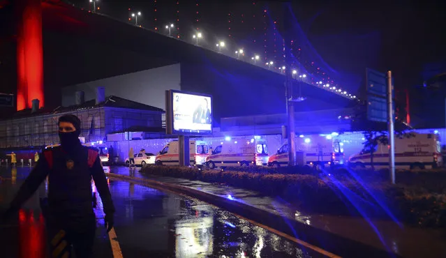 Medics and security officials work at the scene after an attack at a popular nightclub in Istanbul, early Sunday, January 1, 2017. (Photo by IHA via AP Photo)