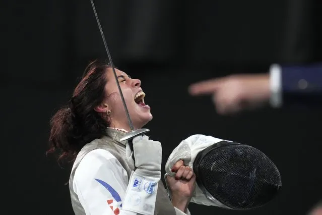 Chile's Arantza Inostroza celebrates her victory over Brazil's Ana Di Renzo at the end of a women's foil individual fencing competition at the Pan American Games in Santiago de Chile, Chile, Monday, October 30, 2023. (Photo by Matias Delacroix/AP Photo)