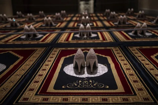 “Silence”, an installation by French Algerian artist Zoulikha Bouabdellah that displays 30 pairs of stiletto heels on the same number of Islamic prayer rugs, is photographed at Barcelona's Museum of Forbidden Art in Barcelona, Spain, Wednesday, November 8, 2023. Bouabdellah agreed to have her work removed from a museum in Clichy, France, after the 2015 attacks in Paris against the staff of the Charlie Hebdo satirical newspaper, which had published cartoons of the Prophet Muhammad. (Photo by Emilio Morenatti/AP Photo)