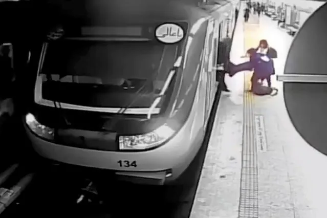 In this image from surveillance video aired by Iranian state television, women pull 16-year-old Armita Geravand from a train car on the Tehran Metro in Tehran, Iran, Sunday, October 1, 2023. The mysterious injury suffered by Geravand not wearing a headscarf while boarding a Metro train in Iran's capital has reignited anger just after the one-year anniversary of the death of Mahsa Amini and the nationwide protests it sparked. (Photo by Iranian state television/AP Photo)