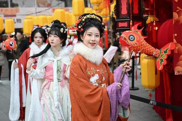 People in traditional Chinese costumes attend a parade to celebrate the upcoming Year of the Dragon on January 28, 2024 in Nanjing, Jiangsu Province of China. The Spring Festival, or the Chinese Lunar New Year, falls on February 10 this year. (Photo by Yang Bo/China News Service/VCG via Getty Images)