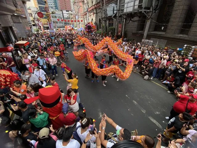 Dancers perform the traditional Lion Dance during the Chinese Lunar New Year at Manila’s Chinatown in Manila, Philippines, 10 February 2024. The Chinese Lunar New Year, also called the Spring Festival, falls on 10 February 2024, marking the start of the Year of the Dragon. (Photo by Francis R. Malasig/EPA)
