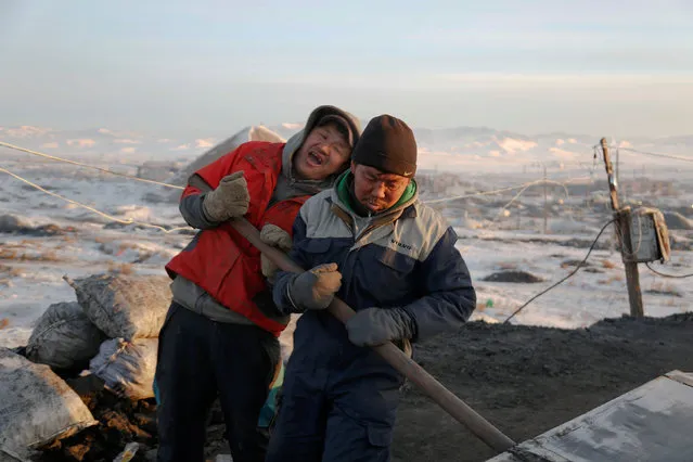 People work at a primitive coal mine outside Ulaanbaatar, Mongolia January 27, 2017. (Photo by B. Rentsendorj/Reuters)