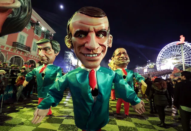 Giant figures (L-R) of Francois Fillon, former French prime minister, member of The Republicans political party and 2017 presidential candidate of the French centre-right, Emmanuel Macron, head of the political movement En Marche! or Onwards!, and French President Francois Hollande are paraded through the crowd during the 133rd Carnival, the first major event since the city was attacked during Bastille Day celebrations last year in Nice, France, February 11, 2017. (Photo by Eric Gaillard/Reuters)