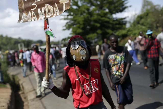 Protesters march through the Musaga district of Bujumbura, in Burundi, Monday, May 11, 2015. (Photo by Jerome Delay/AP Photo)